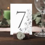 Elegant Lily Floral Wedding Table Number Card<br><div class="desc">Add a graceful finishing touch to your reception tables with this elegant floral wedding table number card. Featuring delicate lily line-art illustrations along the edge, the design blends timeless botanical beauty with a clean, minimalist layout that feels both modern and sophisticated. The bold table number stands prominently at the center,...</div>