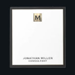 Elegant Luxury Monogram Notepad<br><div class="desc">Elevate your stationery game with this monogrammed notepad featuring classic block typography and a black frame with a brushed gold medallion monogram. The notepad includes space for custom text, such as your name and title, making it perfect for personal or professional use. Use it to jot down notes, ideas, and...</div>