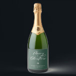 Elegant Merry Christmas Script Green Holiday Sparkling Wine Label<br><div class="desc">Festive Merry Christmas script lettering,  holiday bottle labels. Design features,  snowflake accent and whimsical white holiday typography quote on green background. Two template text lines for your message and name.</div>