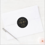 Elegant Minimal Black Gold Monogram Wedding Crest Classic Round Sticker<br><div class="desc">This elegant and classic round sticker, featuring a minimal monogram wedding crest adorned with delicate wine leaves in golden hues, epitomises timeless sophistication. The black and gold design, enhanced by a faux gold foil finish, adds a touch of luxurious charm. Perfect for sealing envelopes or adding refined detail to wedding...</div>