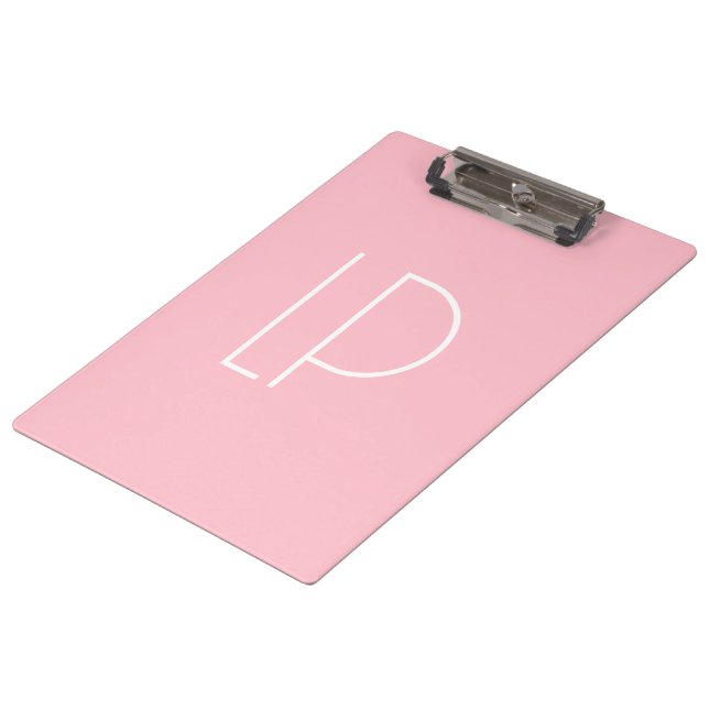 Elegant minimalist modern initial on pastel pink clipboard (Angled)