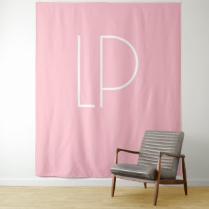 Elegant minimalist modern initial on pastel pink tapestry