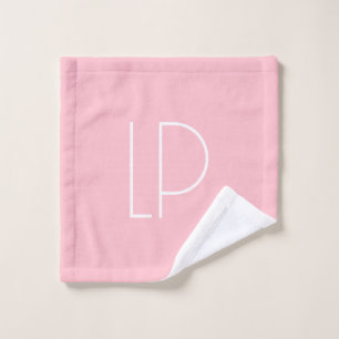 Elegant minimalist modern initial on pastel pink wash cloth