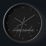 Elegant Modern Personalised With Name Monogram Clock<br><div class="desc">Elevate your home decor with our Blackout Sleek Elegant Modern Personalised With Name Monogram Clock. This finely crafted wall clock seamlessly blends contemporary aesthetics with a personalised touch, making it a stylish and functional addition to any room. Featuring your name and a monogram in a sleek blackout style, this clock...</div>