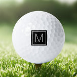 Elegant monogram initial on black square golf balls<br><div class="desc">Golf ball featuring your monogram initial inside a square,  white border on a printed black square background.</div>