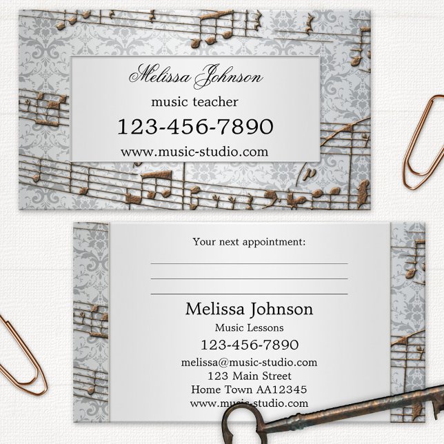 Elegant Music Lessons Appointment Business Cards (Business card with a music theme featuring an elegant grey damask with metallic musical notes)