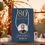 Elegant Navy & Gold 80th & Legendary Birthday Medium Gift Bag<br><div class="desc">Elegant Navy & Gold 80th & Legendary Birthday Gift Bag. Celebrate a truly legendary milestone with this elegant 80th birthday gift bag. Featuring a sophisticated navy background, bold gold-effect text, and a customisable photo and name, this design is perfect for honouring a loved one on their special day. The timeless...</div>