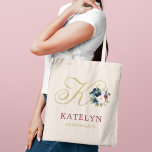 Elegant Navy Gold Wine Floral Monogram Tote Bag<br><div class="desc">Rich and romantic, this tote features a large monogram initial in elegant navy script surrounded by a deep palette of navy, gold, and wine watercolor florals with a personalized name and bridal party role beneath. A sophisticated keepsake that complements fall, winter, and jewel-toned wedding palettes beautifully. Name, initial, and role...</div>