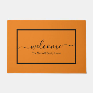 Elegant orange black script family name welcome  doormat