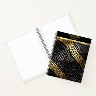 Elegant patterns of a black and gold snake skin notebook