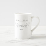 Elegant PhD Grey Gold Graduation Bone China Mug<br><div class="desc">An elegant PhD graduation mug with a silver tone (non-foil) decoration, white background, and grey lettering. Simply add your information, add this mug to your cart, and celebrate this major accomplishment.
Elegant PhD Grey Gold Graduation Bone China Mug
Holidayday Design | ©Melissa Patton - Designer</div>