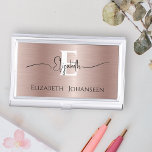 Elegant Rose Gold Brushed Metal Script Monogrammed Business Card Holder<br><div class="desc">Keep your business cards organised in style with our Elegant Rose Gold Brushed Metal Script Monogrammed Business Card Case! Crafted with a luxurious rose gold brushed metal texture, this sophisticated case adds a touch of elegance to your professional accessories. Personalise your monogram in bold white text, creating a striking focal...</div>