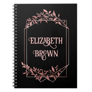 Elegant rose gold frame leaves black notebook