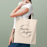 Elegant Round Leaves Personalized Name Business Tote Bag<br><div class="desc">Stylish business tote bag features a custom design for a small business owner with first and last name in modern calligraphy script framed by a round wreath with rustic chic laurel leaves. Personalize the curved text with a business name or other preferred wording.</div>