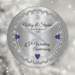 Elegant Sapphire Diamonds 45th Wedding Anniversary Round Clock<br><div class="desc">Opulent elegance frames this 45th wedding anniversary design in a unique scalloped diamond design with centre teardrop diamond with heart-shaped sapphire accents and faux added sparkles on a silver-tone gradient. Please note that all embellishments are printed and are only made to appear as real as possible in a flat, printed...</div>