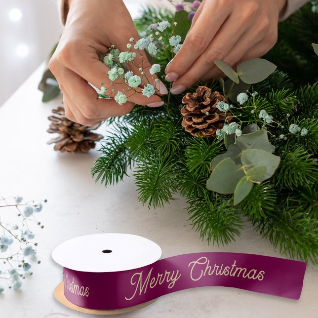 Elegant Script Festive Burgundy Merry Christmas Satin Ribbon (An elegant roll of ribbon with 'Merry Christmas' in faux gold script on a dark red background)