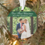 Elegant Script Green Our First Christmas Ornament<br><div class="desc">Elegant Stylish Script Our First Christmas Wedding Photo Green Ornament with Snowflakes back</div>