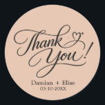 Elegant Script Thank You Sticker<br><div class="desc">A romantic,  personalized “Thank You!” sticker featuring elegant flowing calligraphy with delicate swashes and a subtle heart accent. Customized with names and date,  this timeless black-on-white design is perfect for weddings,  engagements,  and special celebrations. A graceful finishing touch for your unforgettable day.</div>
