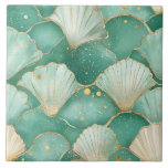 Elegant Seashell & Gold Coastal Ceramic Tile<br><div class="desc">Bring the tranquil beauty of the ocean into your home with this luxurious ceramic tile featuring a watercolor-inspired seashell pattern. The design showcases soft seafoam greens, turquoise, and aqua tones, delicately accented with shimmering gold outlines and subtle splashes, evoking the peaceful charm of a tropical seashore. Each tile feels like...</div>