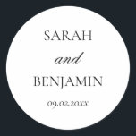 Elegant Simple Black & White Wedding Envelope Classic Round Sticker<br><div class="desc">These simple, yet elegant, wedding stickers can be used for wedding invitation envelopes, engagement parties, bridal showers, rehearsal dinners, wedding favours, out-of-town guest gift baskets etc.. The neutral, black and white, minimalist design features a modern, handwritten calligraphy script and a vintage serif font and includes your names and wedding date....</div>