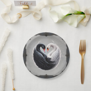 Elegant swans forning a heart together.  paper plate