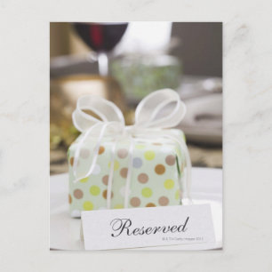 Elegant table setting with gift postcard