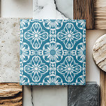 Elegant Teal Portuguese Pattern Symmetrical White Tile<br><div class="desc">This Elegant Teal Portuguese Pattern Symmetrical White ceramic tile features a vintage-inspired pattern of intricate teal and white floral motifs, perfectly symmetrical to bring a sense of balance and harmony to any space. With its refined ornamental geometric shapes, this tile exudes a luxurious and sophisticated aesthetic that is ideal for...</div>