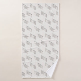 Elegant white and gold cutlery arranged diagonally bath towel