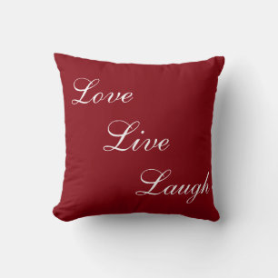 Elegant white calligraphy on burgundy red cushion