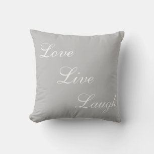 Elegant white calligraphy on light grey cushion