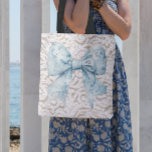 Elegant White lace blue bow Tote Bag<br><div class="desc">These elegant totes are perfect for your leisurely lifestyle! With a chic white lace pattern and blue bow decal these totes can be taken to endless farmers markets,  strolls through the streets on vacation or sitting beachside.</div>