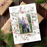 Elegant White Winter Watercolor Greenery Photo Holiday Card<br><div class="desc">This elegant and festive holiday photo card features a beautiful watercolor wreath of holly, eucalyptus, and berries over a classic white background. The editable greeting on the front says "Happiest Holidays". The back of the card is a festive red colour. You can also add another photo and/or additional text to...</div>