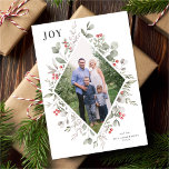 Elegant Winter Watercolor Greenery White Photo Holiday Card<br><div class="desc">This elegant and festive holiday photo card features a beautiful watercolor geometric frame of holly, eucalyptus, and berries over a classic white background. The editable greeting on the front says "JOY". The back of the card is a festive red colour. You can also add another photo and/or additional text to...</div>