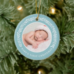 Elegant Wreath Baby's First Christmas | Photo Ceramic Tree Decoration<br><div class="desc">Create a special keepsake for baby's very first Christmas with this stylish photo ornament!  It features a pretty laurel wreath in white surrounding the circle shaped photo template. Text templates are included on the back for baby's name and the year.</div>