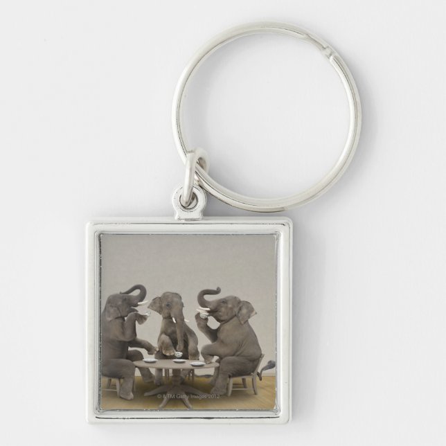 Elephants having tea party key ring (Front)