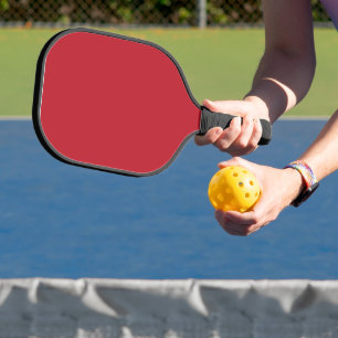 Elevate Your Design a Red Background and White Pickleball Paddle