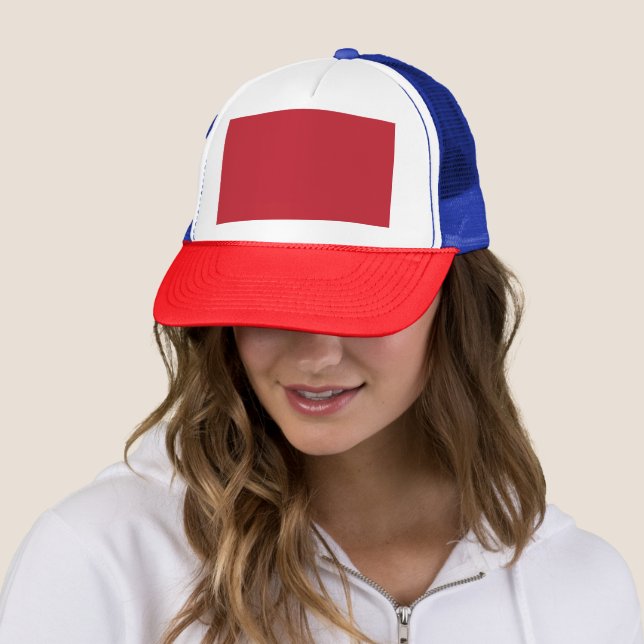 Elevate Your Design a Red Background and White  Trucker Hat (In Situ)