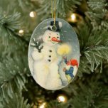 Elf and Snowman Vintage Christmas Ornament<br><div class="desc">One of Santa's elves holds a lighted candle up for a Snowman to see. One of the cutest Victorian era Holiday images that helps celebrate Christmas the old fashioned way! Both sides of this ornament have the same image.</div>