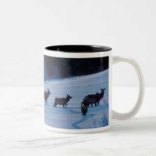 Elk herd walking through field Two-Tone coffee mug