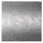 Embossed Polished Silver Roses and Tulips Tile<br><div class="desc">Elegant floral design featuring sprays of dimensional silver roses, tulips and foliage on a glowing gradient silver background. Note: Sculpted, engraved, embossed and dimensional effects, layered, aged or eroded appearance, textures and shadows achieved digitally. Actual product has a smooth surface.</div>