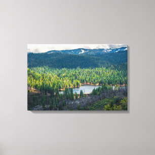 Emerald Basin Beneath Mountain Clouds Canvas Print