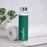 Emerald Green Personalised Wedding Bridesmaid Water Bottle<br><div class="desc">Gift your wedding bridesmaid or maid of honour with this trendy, vacuum Insulated water bottle that features her name in white, stylised script on an emerald green colour background designed to match your wedding colour scheme. Personalise bottle by editing and replacing name with your own as desired. Select your water...</div>