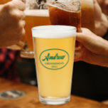 Emerald Green Stylised Wedding Groomsman Name Glass<br><div class="desc">Beer glass for the wedding groomsman that features his name printed in a trendy, emerald green colour, stylised script inside an emerald green, oval border along with wedding date. A great party supply idea for a bachelor party! Personalise your beer glass by editing and replacing name and date with your...</div>