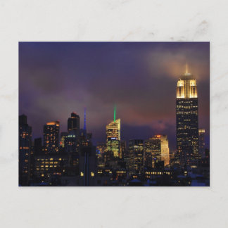 Emp St Bldg glows in clouds and fog Postcard
