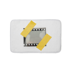 Empty 35mm film frame, yellow strips. bath mat
