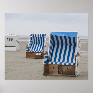 empty beach chairs on beach poster