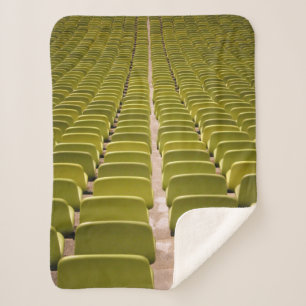 Empty yellow chair lot sherpa blanket