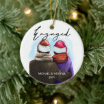 Engaged Script Watercolor Couple and Names Ceramic Tree Decoration<br><div class="desc">Engaged,  personalised christmas tree ornament. This watercolor design has a trendy illustration of a couple wearing santa hats. "Engaged" is hand lettered in modern script and the template is ready for you to add your names and the year. Double sided with the same design on both sides.</div>