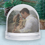 Engaged simple elegant script 2 photos keepsake snowglobe<br><div class="desc">Modern keepsake snow globe template for an engaged couple with two custom photos and a classic gold calligraphy script.              Easy to personalise it with your pictures,  names,  and engagement date!</div>