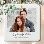 Engagement Photo Christmas Ceramic Ornament<br><div class="desc">This Engagement Christmas Ornament is decorated with watercolor mistletoe and stylish script typography. Easily customisable with your photo, name, and year. Use the Design Tool to change the text size, style, or colour. Because we create our artwork you won't find this exact image from other designers. Original Watercolor © Michele...</div>